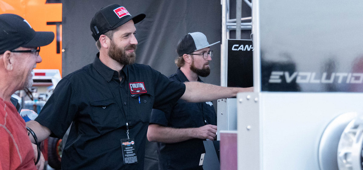 Evolution Powersports team member connecting with riders at an event